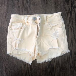 AE Festival Ripped Yellow Jean Shorts